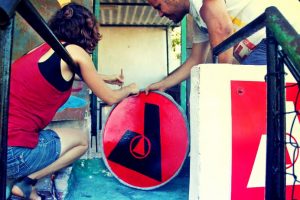 volunteers at ABRA assemble the sign for the space