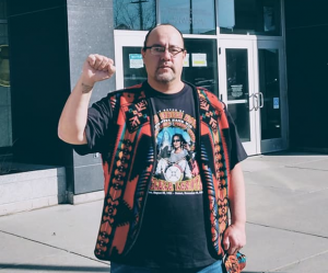 Steve Martinez giving a fist up salute in front of Federal Courthouse in Bismark, ND