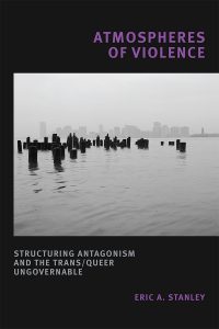 Book cover of "Atmospheres of Violence" by Eric Stanley featuring a photo of pier-tops sticking out of water with a hazy city in the distance